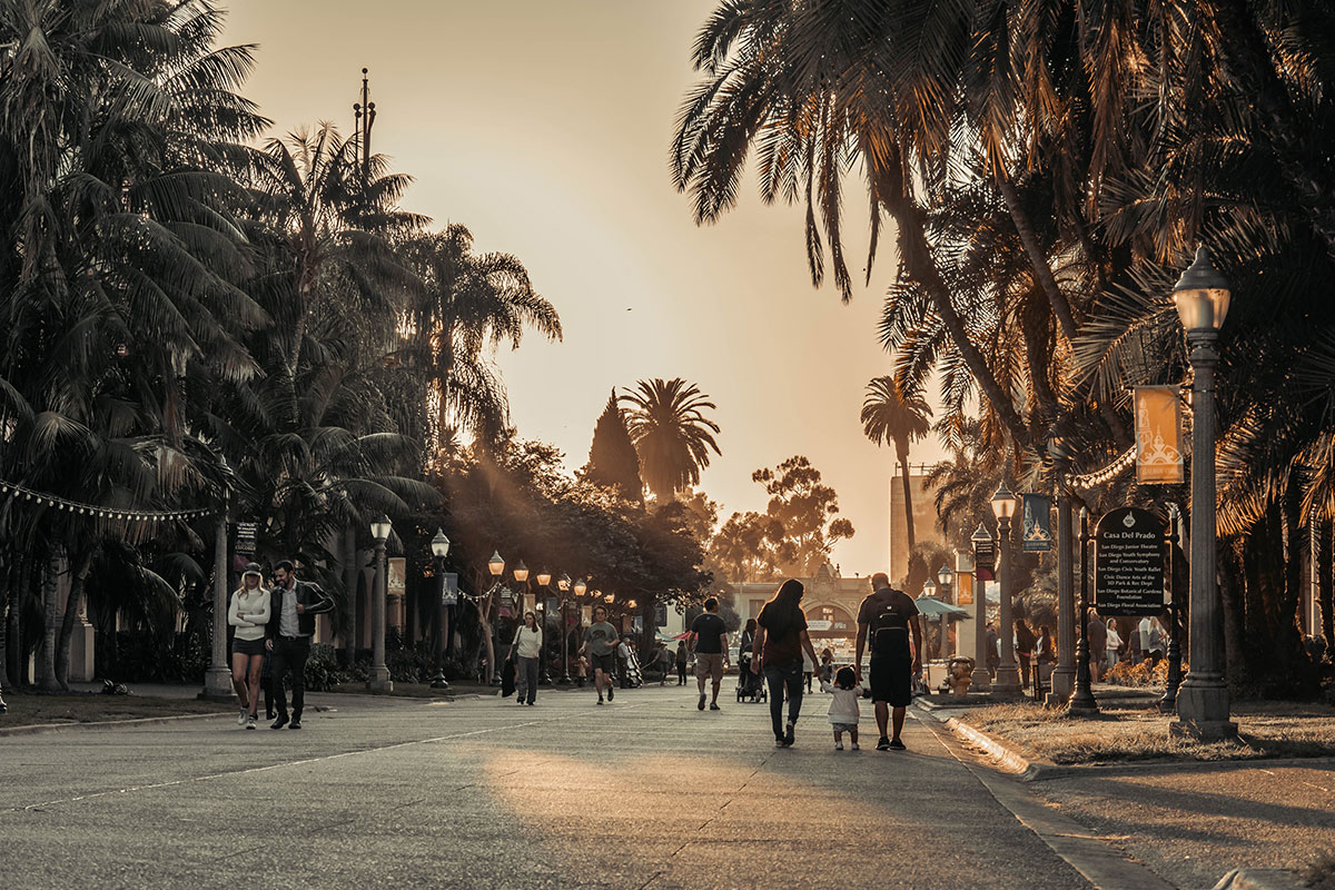 People walk near Casa del Prado in Balboa Park in San Diego